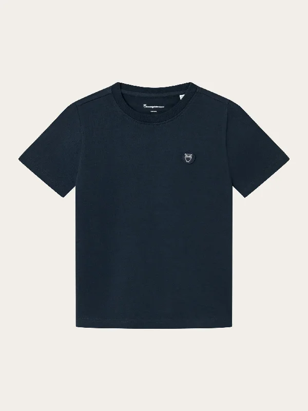 Men's distressed denim - look t - shirts with a rugged appealRegular fit badge t-shirt - Total Eclipse Men's distressed denim - look t - shirts with a rugged appealRegular fit badge t-shirt - Total Eclipse